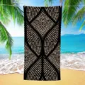 Detailed view of geometric printed beach towel with black and beige abstract tribal pattern. - 70*140cm / HSTJ33-3