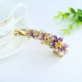 Enamel flower banana hair clip crystal rhinestone metallic hair accessory detail view. - Purple