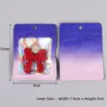 Kleurrijke laser PP folie vensterzelfdichtende verpakkingszakken met ophanggaten voor sieraden. - 10 stuks/Verpakking / 9x12cm Verloop Laser Paars Venster
