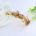 Gold rhinestone butterfly banana clip for women, elegant alloy hair accessory for daily wear. - Coffee