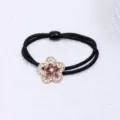 Chouchou de cheveux fleur en strass, élastique noir double brin pour queue de cheval élégante. - Style Fleur