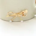 Barrette à cheveux nœud en métal doré avec perles pendantes élégantes pour femme chic. - Barrette Latérale Suspendue Perle Nœud(H009998) / Or