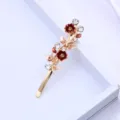 Pince à cheveux en alliage doré avec strass et fleurs en émail rouge, accessoire élégant pour femme. - Café