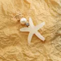 Jolie pince à cheveux étoile de mer avec perle et strass, barrette latérale élégante pour femmes. - Blanc