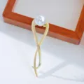 Pince a cheveux en metal dore avec fausse perle, design torsade elegant, belle variante. - HB01359