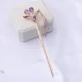 Bâtonnet à cheveux en alliage doré avec strass violets et pompons élégants pour coiffure de mariée. - Violet