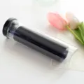 Lot d'élastiques à cheveux noirs sans coutures dans un cylindre transparent et élastique. - Noir