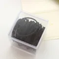 Black elastic hair ties set in a clear plastic storage box, simple and durable for daily wear. - Black
