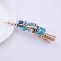 Elegant alloy floral hair clip with blue enamel and rhinestones for women daily styling. - Blue