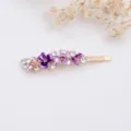Elegant gold-toned hair clip featuring purple enamel flowers and sparkling crystal rhinestones. - RY07626(Purple)