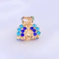 Mini pince à cheveux en métal avec strass bleus étincelants, accessoire élégant et compact. - Bleu