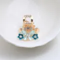 Mini pince a cheveux en metal avec papillon emaille bleu et strass scintillants pour coiffure. - Bleu
