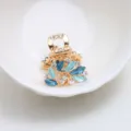 Mini pince à cheveux dorée avec strass bleus et émail, taille compacte de 2.5cm pour style. - Bleu
