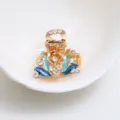 Mini pince à cheveux élégante en métal strass avec design de feuille émaillée bleue pour femmes. - Bleu