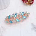 Molletta per capelli a forma di foglia in oro rosa con strass blu, accessorio elegante. - Stile Foglia (F014738) / Blu lago