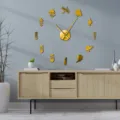 Gold acrylic barber wall clock detail showing creative DIY hairdressing silhouette design. - Gold