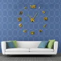 Details of large DIY acrylic mirror wall clock with 3D gold digits for living room decor. - Gold