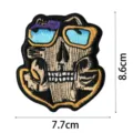 Music skull embroidery patch detail view, perfect for jackets, clothing and DIY decoration. - DW9082-13