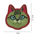 Close-up detail shot of the green cat embroidery patch showing fine stitching and size. - Style 5