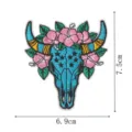 Detail shot of a western cow skull embroidery patch with floral motifs, close-up texture. - Skull Hibiscus (DW9282-5)