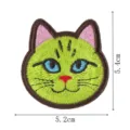 Close-up detail view of the cute green cat embroidered patch with dimensions for clothing repair. - Style 8