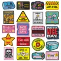 Detailed view of funny embroidered patches with humorous slogans, perfect for DIY clothing decor. - Set of 20
