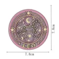 Detailed view of the round Leo constellation embroidered patch in purple and gold, 7.8cm size. - Leo