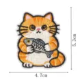 Cute orange cat holding fish embroidery patch detail view, 4.7x5.3 cm size for clothing decor. - Cat Holding Fish