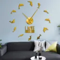 Golden acrylic dolphin wall clock detail shot, modern living room decor quartz timepiece. - Gold