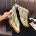 Detailed view of the 70cm elegant chain print silk square scarf, vintage design with border. - RY-19