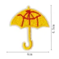 Embroidered yellow umbrella patch with red skeletal design, cute clothing accessory badge. - DW9171-1