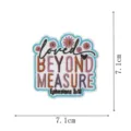 Detailed shot of the embroidered patch featuring floral designs and encouraging scripture text. - Loved Beyond Measure Style (DW9156-9)