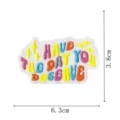 Detailed view of colorful embroidered fabric patch with positive slogan and size guides. - Positive Energy Slogan (DW9802-5)