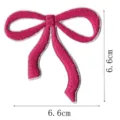 Close-up detail of a pink embroidered bow patch, showing fine stitching texture and clear size. - Bowknot Style(DW9067-22)