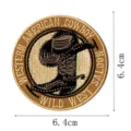 Close-up detail of western cowboy embroidered patch with hat and boots design, 6.4cm size - DW9055-6