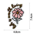Embroidered patch detail featuring pink flower motif and inspirational quote lettering. - DW9122-17