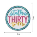 Round embroidered patch featuring blue rope border and colorful design for apparel. - Embroidered Patch (DW9805-2)