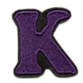 Closeup of purple embroidered letter K patch for clothing DIY decoration and repair. - Letter K