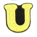 Embroidered letter U patch detail shot, yellow and black color cloth badge accessory. - Letter U