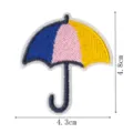Detailed close-up view of the colorful umbrella embroidered patch showing fine stitching and size. - DW9171-7