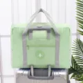 Wasserdichte faltbare Reisetasche Kofferorganizer mit Trolley-Schlaufe und Flugzeug-Logo. - Einlagig / Grün