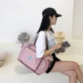 Pink travel duffel bag for women, lightweight waterproof gym bag with shoe compartment. - Pink