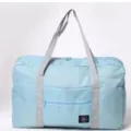 Bolsa de viaje plegable ligera de nailon azul claro con correas grises y bolsillo. - Azul