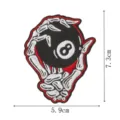 Close-up of a skeleton hand 8 ball embroidered patch, detailed stitching and vibrant red border. - 8 Ball(DW9804-39)