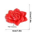 Detailed view of the 3D printed red flower fridge magnet, showing clear textures and size. - Red-E