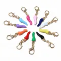 Close-up of colorful enamel chili charms with lobster clasps, ideal for DIY jewelry making. - Random Mix