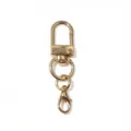 Accessoire de quincaillerie mousqueton porte-cles en alliage dore vue de detail. - 50x12mm / Or KC