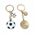 Gold metal keychains with enamel football and sunburst disc pendants, bag charms. - Football-15