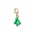 Gold alloy lobster clasp with green enamel imitation coral pendant, detail close-up view. - Green