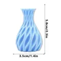 Close-up detail of a blue 3D printed magnetic vase fridge magnet showcasing unique wave texture. - H Pattern Light Blue
